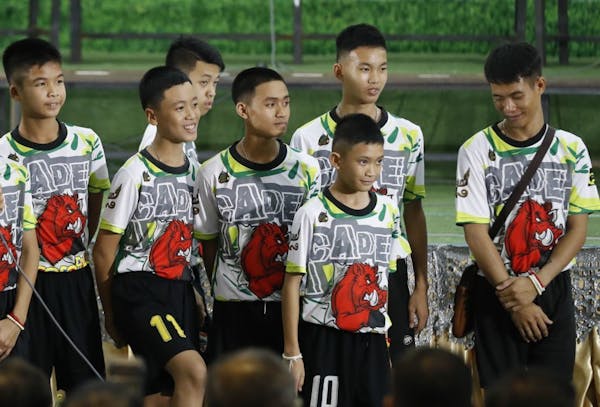 Members of the rescued soccer team attend a press conference discussing their experience being trapped in the cave in Chiang Rai, northern Thailand, W