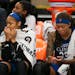 Injured Lynx forward Rebekkah Brunson, left, forward Maya Moore, and guard Seimone Augustus watched from the bench during the final minutes of the Lyn