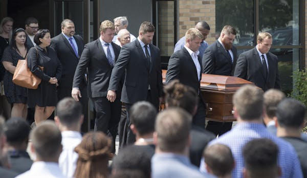 Vikings offensive linemen carry the casket of offensive line coach, Tony Sparano after his funeral was held at St. Bartholomew Catholic Faith Communit