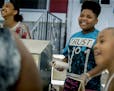 Thirteen-year-old hot dog entrepreneur Jaequan Faulkner, center, along with his cousin Destinee Grandberry, 12, left, cq, was all smiles after the cit