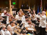 Osmo Vänskä conducts the Minnesota Orchestra during the "Celebrating Mandela at 100" concert at Orchestra Hall.