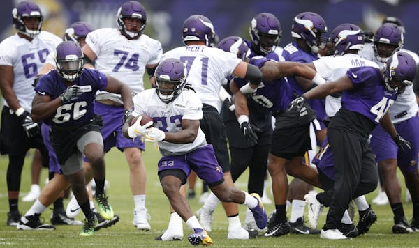 Minnesota Vikings running back Dalvin Cook (33) ran a play during training camp at TCO Performance center Sunday.