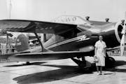 Louise Thaden beside the plane in which she set a new speed record for women in 1936.
