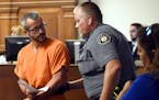 Christopher Watts glances back at a Weld County Sheriff's Deputy as he is escorted out of the courtroom at the Weld County Courthouse Thursday, Aug. 1