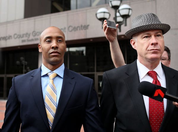 Former Minneapolis police officer Mohamed Noor, left, and attorney Thomas Plunkett in May.