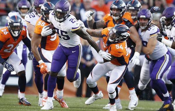 Vikings running back Latavius Murray took off for a big gain after shedding the tackle of Denver’s Brandon Marshall (54).