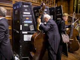 Bass players pack up their instruments into their trunks after the Durban concert in South Africa.
