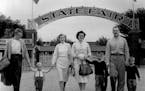 On the opening morning of the 1958 State Fair, two Minneapolis families were there bright and early. At left are Mr. and Mrs. Hal Rindal, with their d