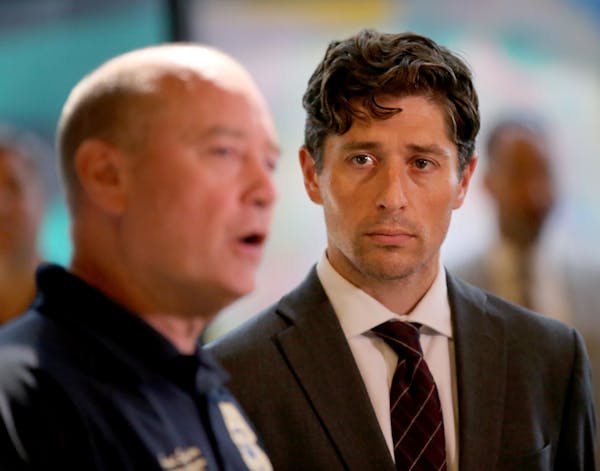 Mayor Jacob Frey listened Thursday as Sgt. Grand Snyder, the Minneapolis Police homeless liaison, spoke at the Minneapolis American Indian Center.