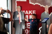Anthony Rossini, 10, wanted to have his photo taken with cutouts of President Donald Trump and Vice President Mike Pence at the Republican booth at th