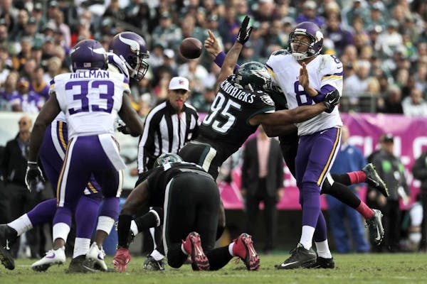 Minnesota Vikings' Sam Bradford, right, fumbles the football as Philadelphia Eagles' Mychal Kendricks tackles during the first half of an NFL football