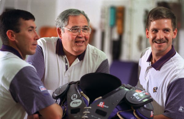 The first athletic trainer for the Vikings, Fred Zamberletti (center) died from complications from a toxic infection. He is pictured with equipment ma