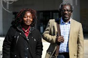 Augsburg Prof. Mzenga Wanyama and his wife, Mary, waited outside the Immigration and Customs Enforcement headquarters in April.
