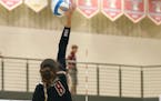 Jasmine Mulvihill (8) goes up for the kill. Mulvihill led Lakeville South with 19 kills in its win over rival Lakeville North on Tuesday night. Photo 