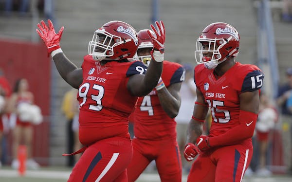 The Associated Press provided many photos of Fresno State Bulldogs celebrating last Saturday during their 79-13 rout of Idaho, this one featuring (lef