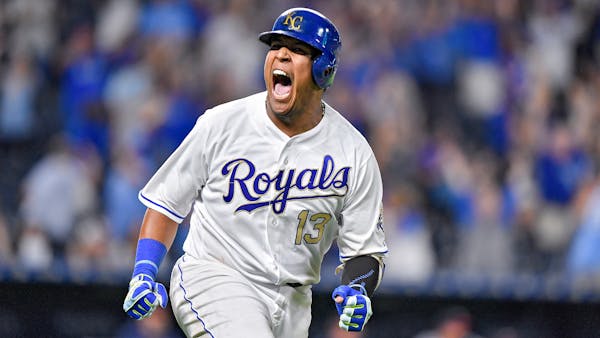 Salvador Perez celebrates his walk off grand slam for an 8-4 win against the Twins on Friday