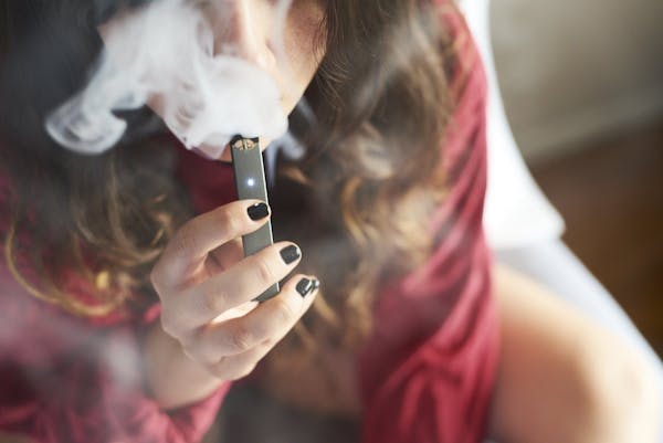 The sleek Juul device, which looks like a computer flash drive, has become popular in high schools.