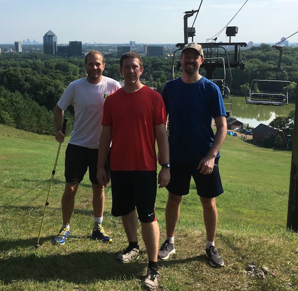 Todd Millenacker, Casey Black and Peter Davich on top of Mount Gilboa at Highland Hills Ski Area in Bloomington, which they climbed 96 times to duplic
