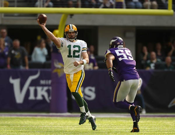 Aaron Rodgers (12) left the game after being sacked by Anthony Barr (55) in the first quarter on Oct. 15, 2017.