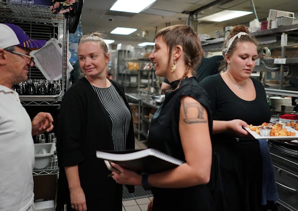 Co-owner Steve Meyer talked with Hell’s Kitchen managers Kjersti Granberg, left, and Jessica Cram, center, who helped turn the restaurant around.