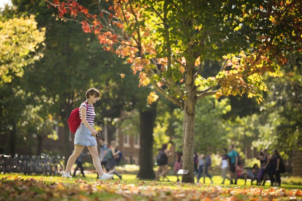 Student walk on campus at Macalester College in 2017.