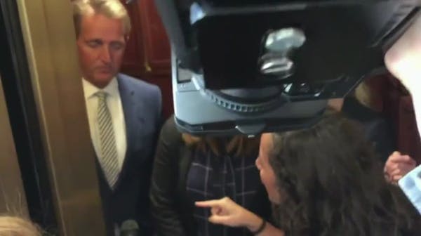 'Look at me:' Women confront Sen. Jeff Flake over Kavanaugh vote