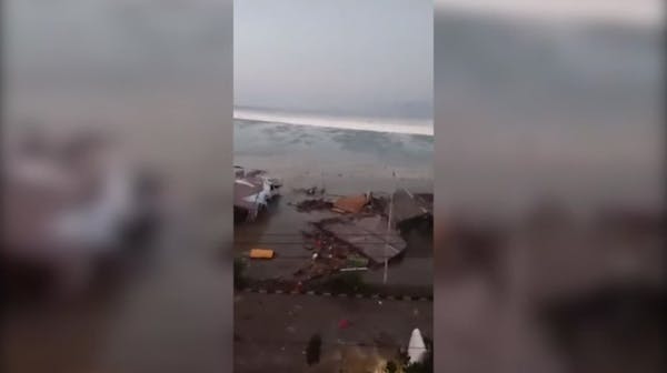 Earthquake-spawned tsunami slams Indonesia