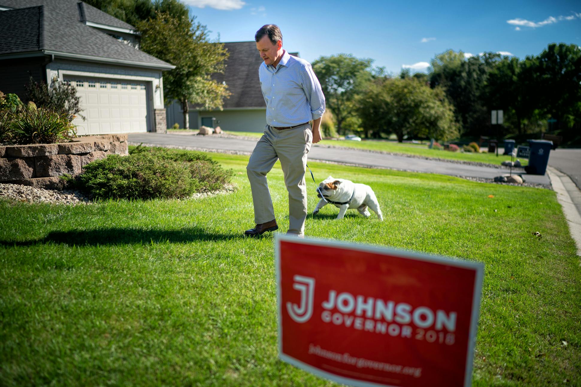 Johnson took his bulldog Chester for a walk before he headed out for an evening fundraiser in Minneapolis.