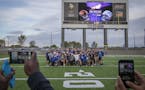 Eagan High School football players take a team photo on the field of TCO Stadium. ] LEILA NAVIDI ï leila.navidi@startribune.com BACKGROUND INFORMATIO