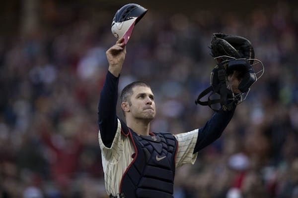 Joe Mauer acknowledged the cheers from fans at Target Field when he came out on the field in his catcher's gear for the ninth inning.