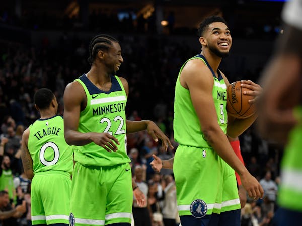 Minnesota Timberwolves center Karl-Anthony Towns (32) and forward Andrew Wiggins (22)