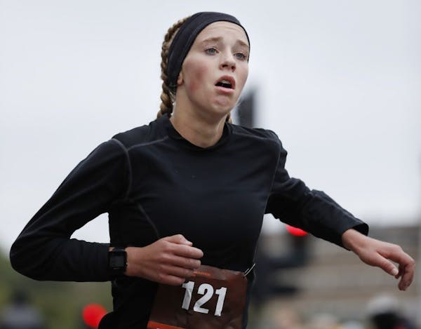 15-year old Tierney Wolfgram of Woodbury, running her first marathon, finished the Twin Cities Marathon in a time of 2:40:03, good for sixth place amo