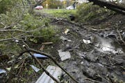 Debris scatters an area Sunday, Oct. 7, 2018, at the site of yesterday's fatal crash Schoharie, N.Y.