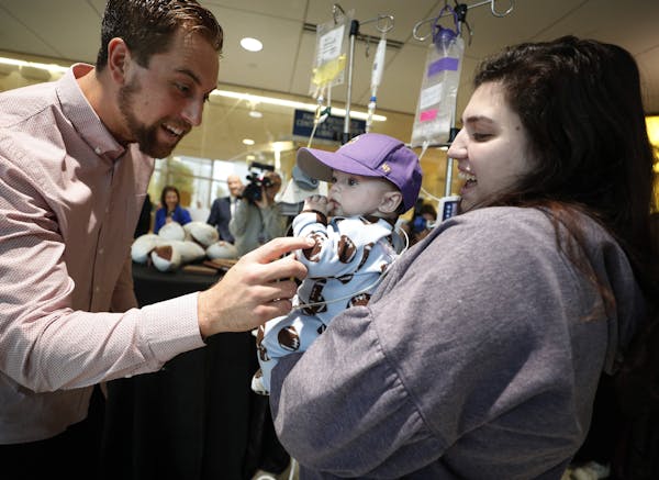 Emma McClure and her 9-month-old son, Easton, visited with Adam Thielen at the U of M Masonic Children’s Hospital.