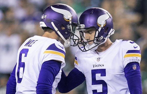 Vikings kicker Dan Bailey and holder Matt Wile celebrated after a 52-yard field goal in the fourth quarter gave the Vikings a 23-14 lead with 2:51 lef