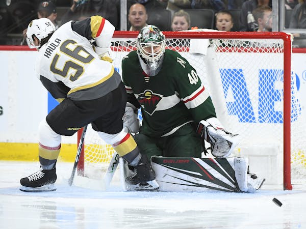 The smaller chest protectors and arm cushions haven’t hindered Wild goalie Devan Dubnyk, shown stopping Vegas’ Erik Haula on Saturday. Despite sco