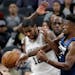 Spurs forward LaMarcus Aldridge and Timberwolves guard Jimmy Butler scrambled for a rebound during the first half Wednesday night.