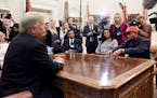 U.S. President Donald Trump, left, hosts a working lunch with musical artist Kanye West, right, to discuss criminal justice system and prison reform o