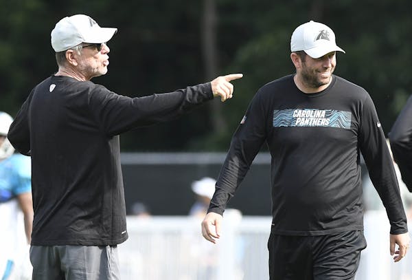Norv Turner, left, is Carolina’s offensive coordinator and his son, Scott, is the team’s quarterbacks coach.