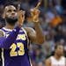 Los Angeles Lakers forward LeBron James (23) celebrates a basket against the Phoenix Suns during the second half of an NBA basketball game, Wednesday,