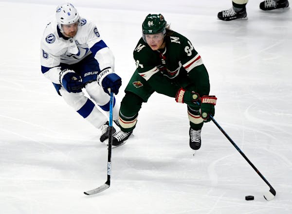 The Wild's Mikael Granlund skates with the puck against the Lightning's Anton Stralman in the third period