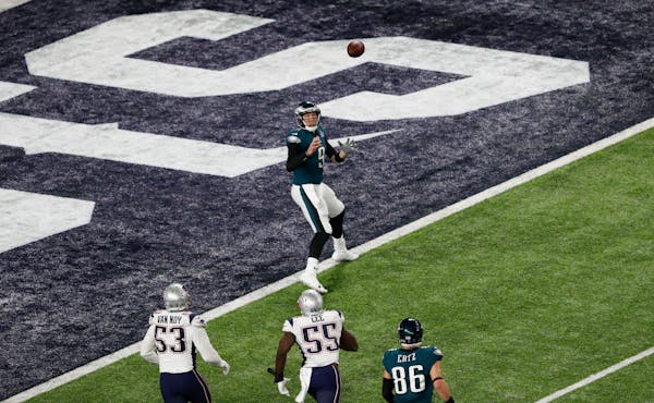 Eagles QB Nick Foles caught a trick-play touchdown pass from tight end Trey Burton on fourth down during Super Bowl LII against the Patriots. More coa