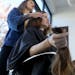Stylist McCall Dunn cut the long locks of Marti Estey, who has been donating her hair to charities for years.