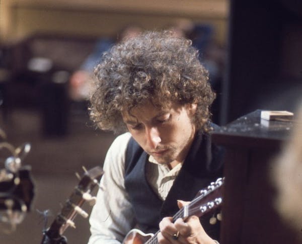 Bob Dylan with a mandolin during the "Blood On the Tracks" sessions.