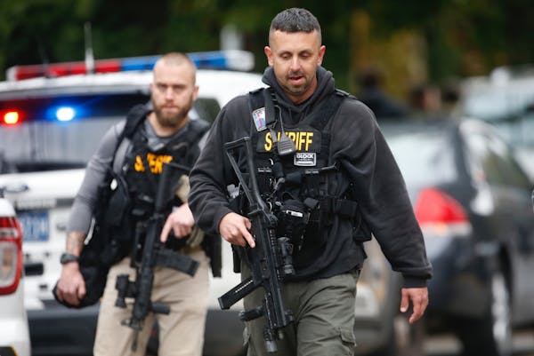 Law enforcement personnel at the scene of a mass shooting at the Tree of Life synagogue in Pittsburgh, Oct. 27, 2018. At least four people were dead a