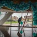 Girl Friday's Michaela Flanagan placed balloons on a decorative installation at the U of M's McNamara Alumni Center's large Memorial Hall event space,