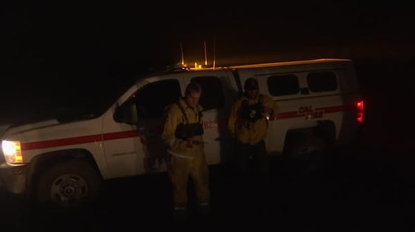 California firefighters work through the night