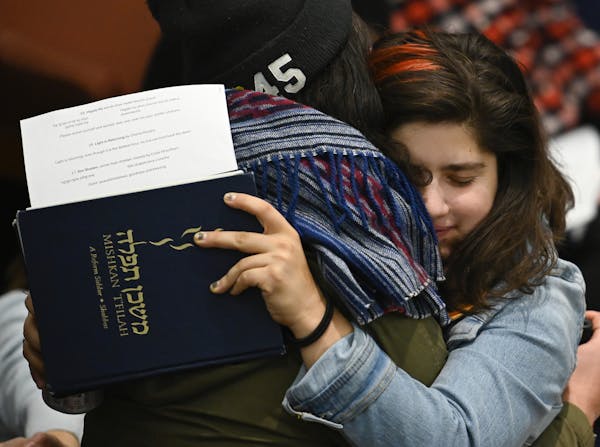Templegoers embraced at Friday’s Shabbat service at Shir Tikvah in Minneapolis.