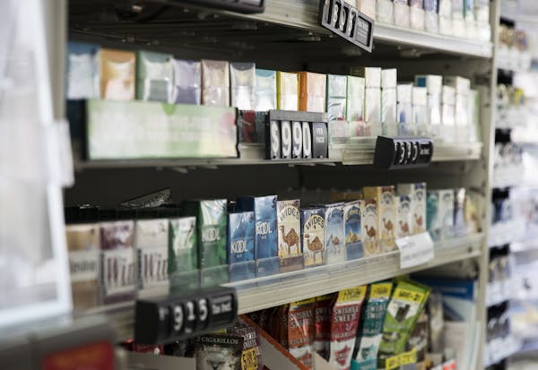 A wall of cigarettes in 2017 at a gas station in Edina, one of the Minnesota cities and counties that raised the legal age for tobacco use to 21.