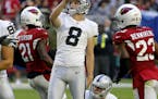 Oakland Raiders kicker Daniel Carlson (8) watches his 49-yard field goal split the uprights against the Arizona Cardinals during the second half of an
